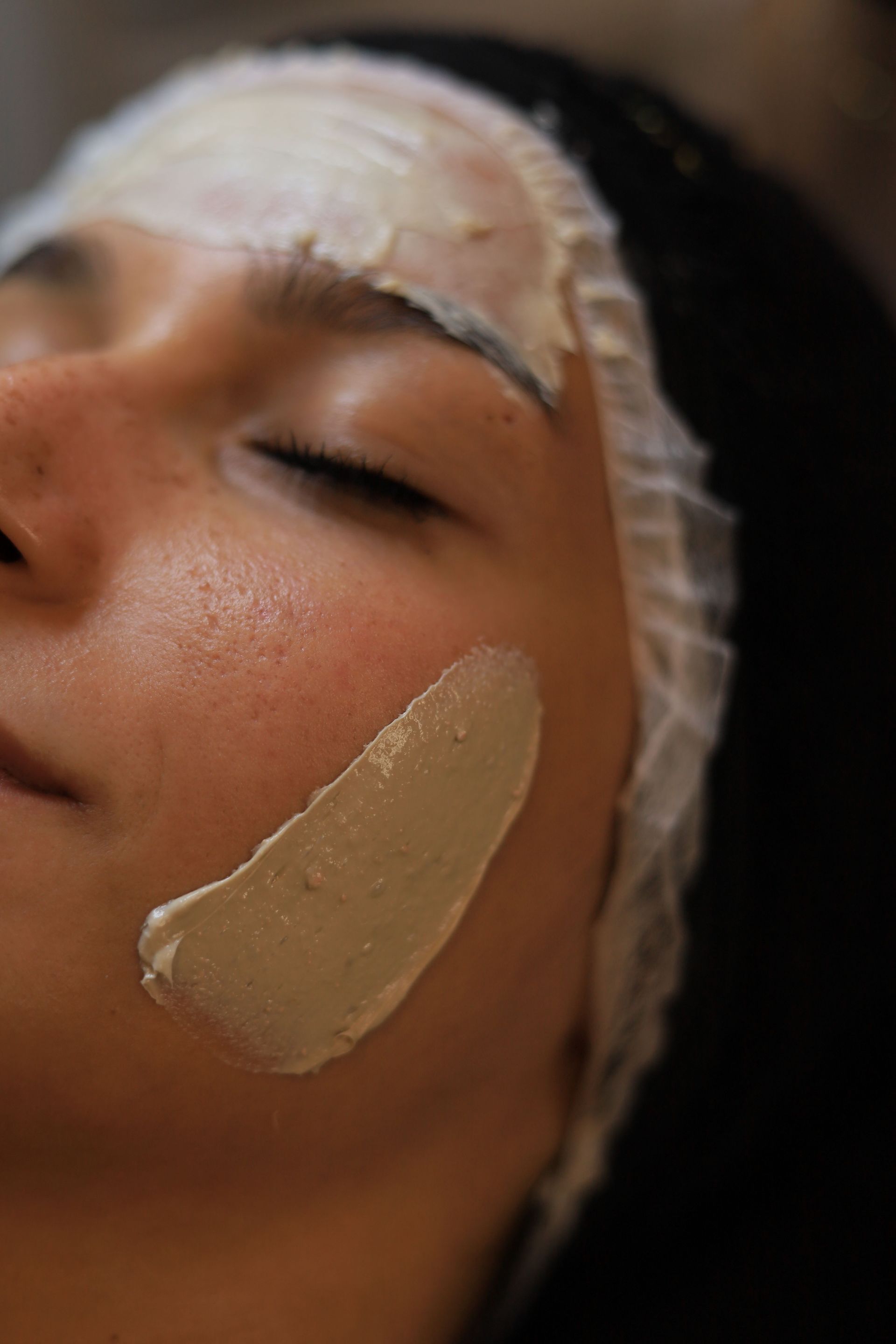 A serene facial treatment with a clay mask for glowing and healthy skin in a beauty clinic.